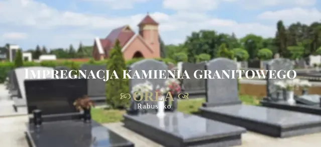 Nagrobki z ciemnego granitu na cmentarzu, w tle kościół